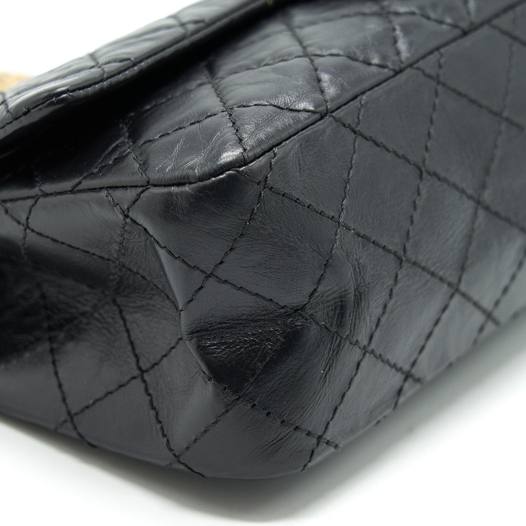 CHANEL 2.55 REISSUE SMALL FLAP BAG AGED CALFSKIN IN BLACK GHW