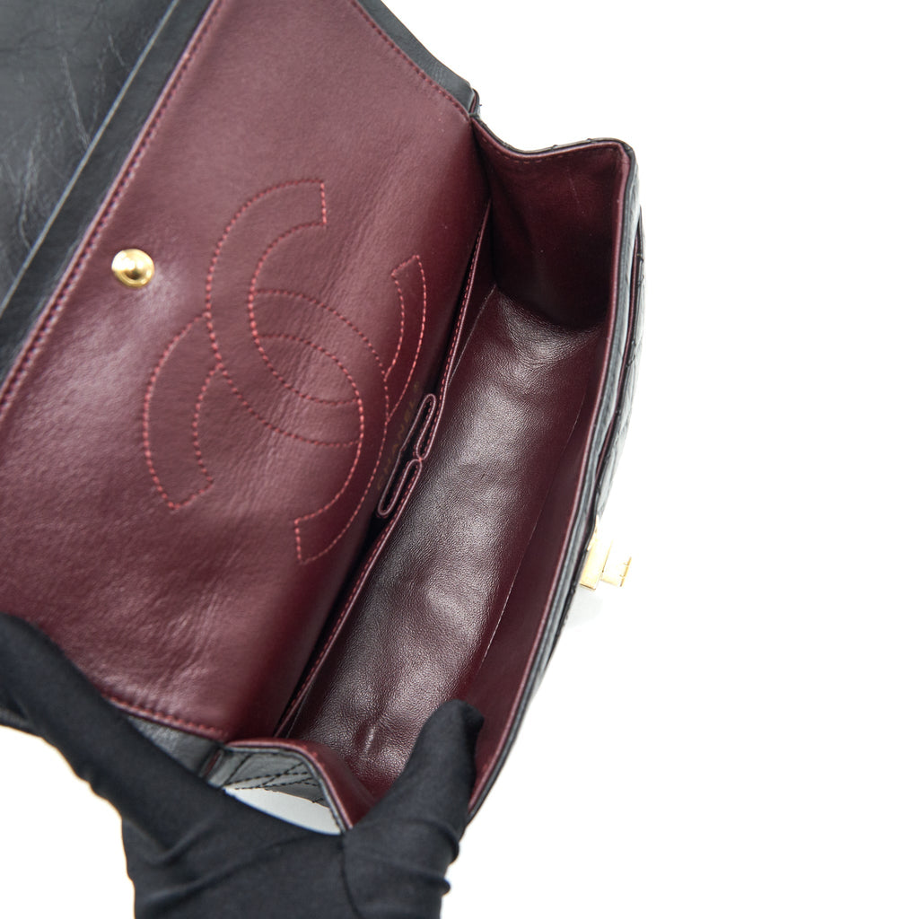 CHANEL 2.55 REISSUE SMALL FLAP BAG AGED CALFSKIN IN BLACK GHW