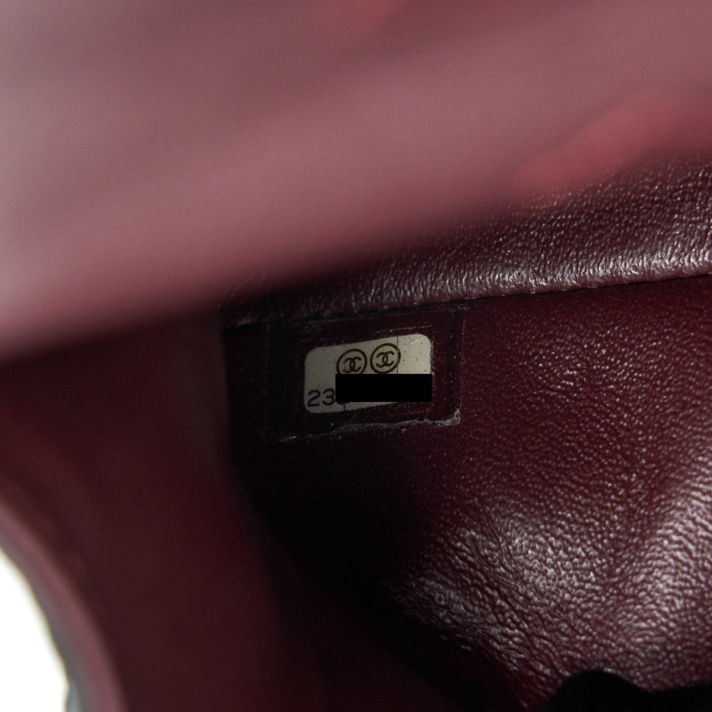 CHANEL 2.55 REISSUE SMALL FLAP BAG AGED CALFSKIN IN BLACK GHW