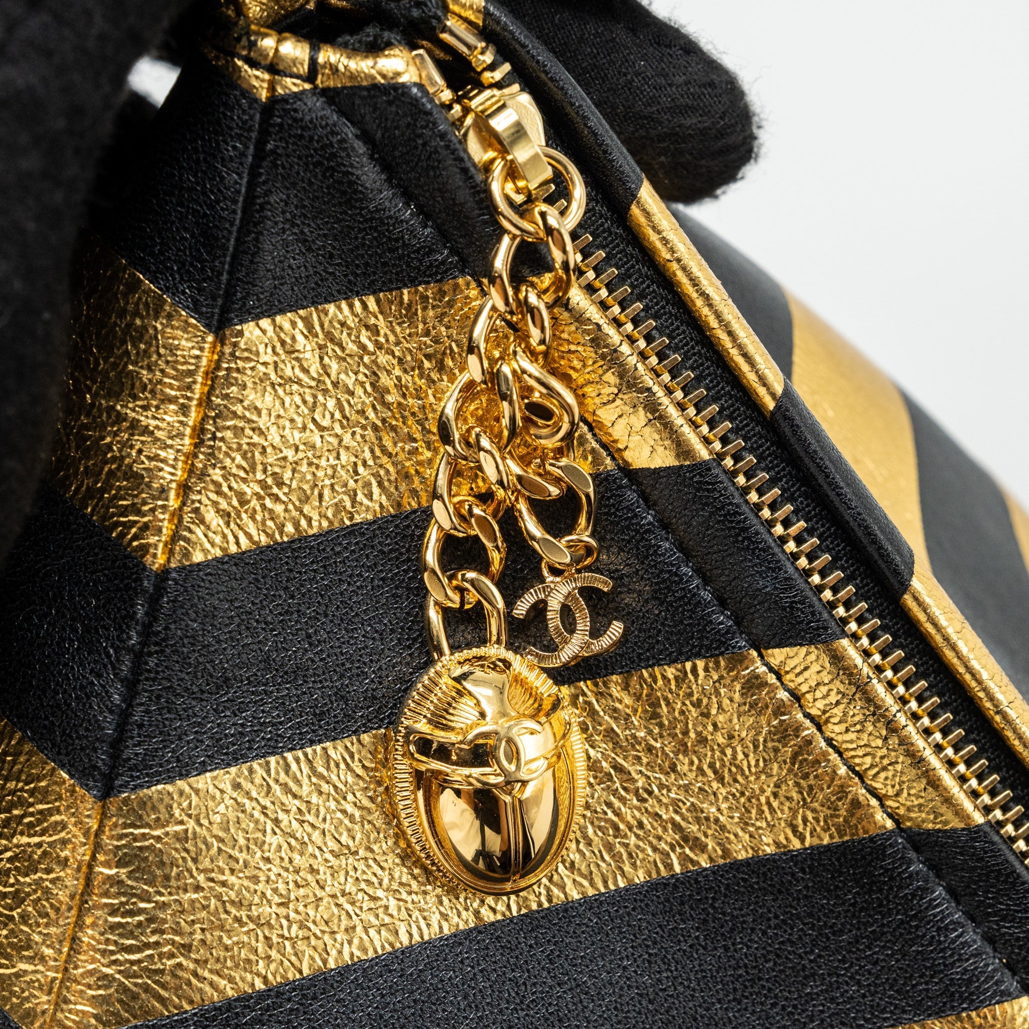 CHANEL 19A CC KHEOPS MISCELLANEOUS PYRAMID CLUTCH LAMBSKIN/METALLIC GOLD/ BLACK GHW