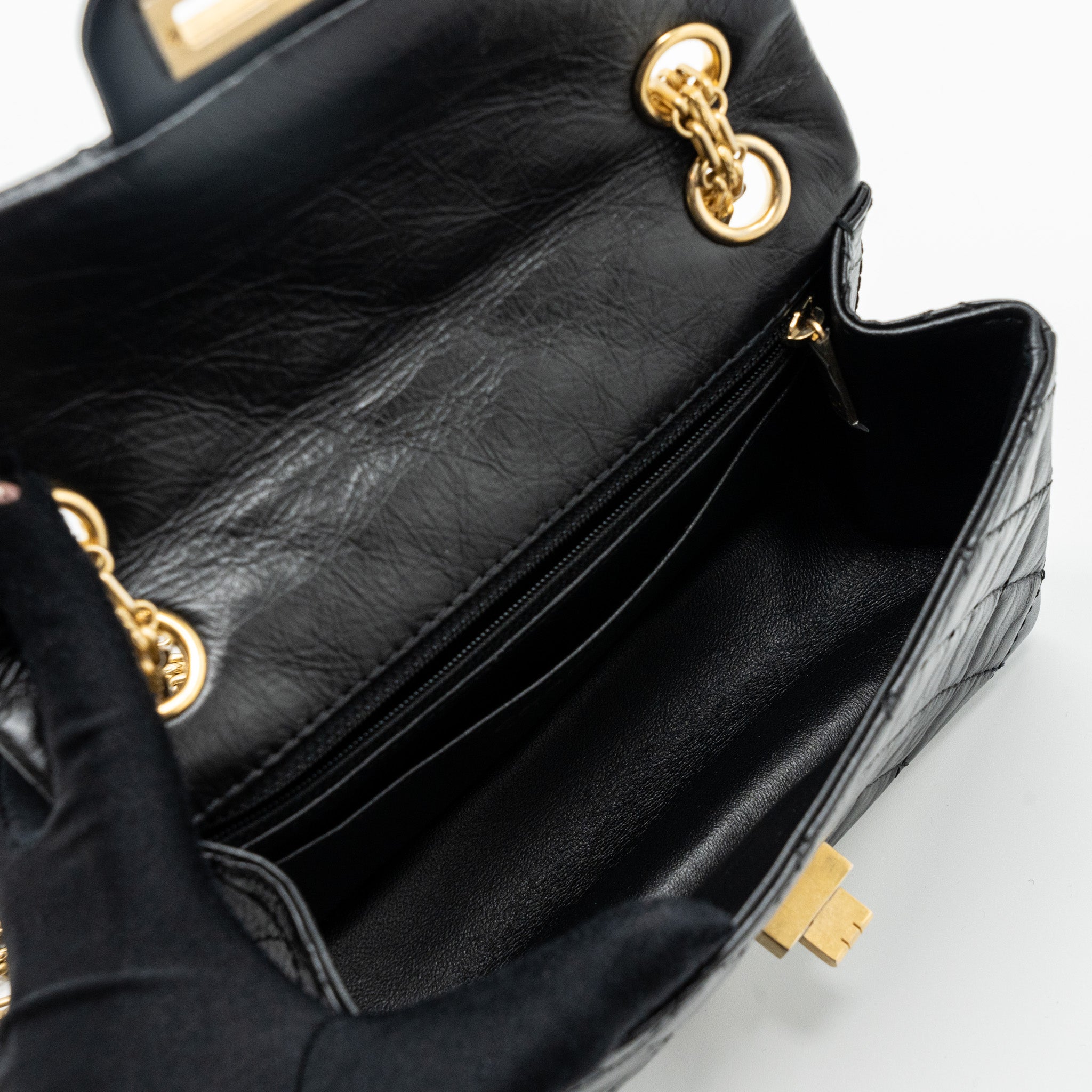 CHANEL MINI 2.55 REISSUE FLAP BAG AGED CALFSKIN BLACK BRUSHED GHW