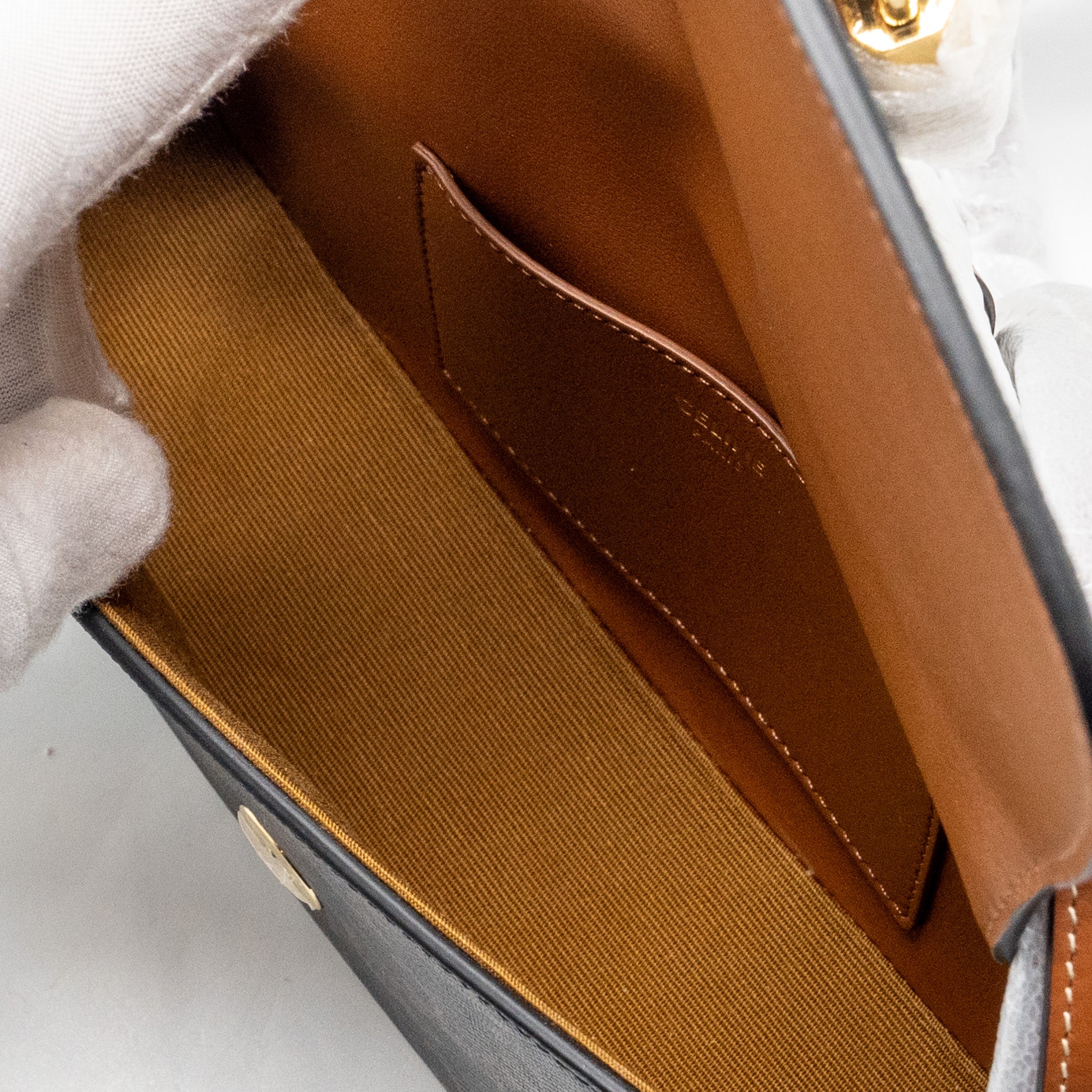 CELINE CLUTCH ON STRAP TABOU IN TRIOMPHE CANVAS / CALFSKIN TAN GHW