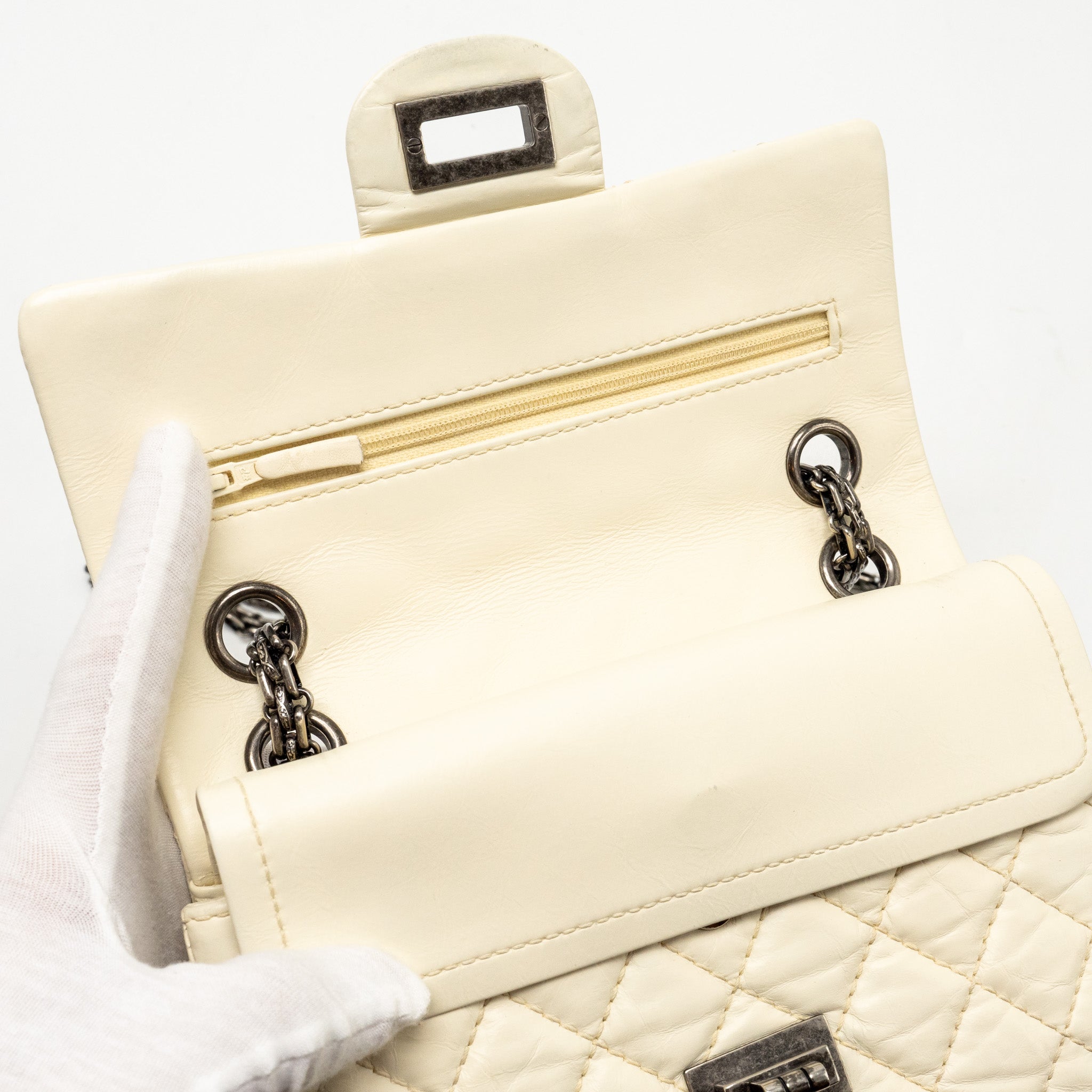 CHANEL MINI 2.55 REISSUE FLAP BAG AGED CALFSKIN CREAMY WHITE WITH RUTHENIUM HARDWARE
