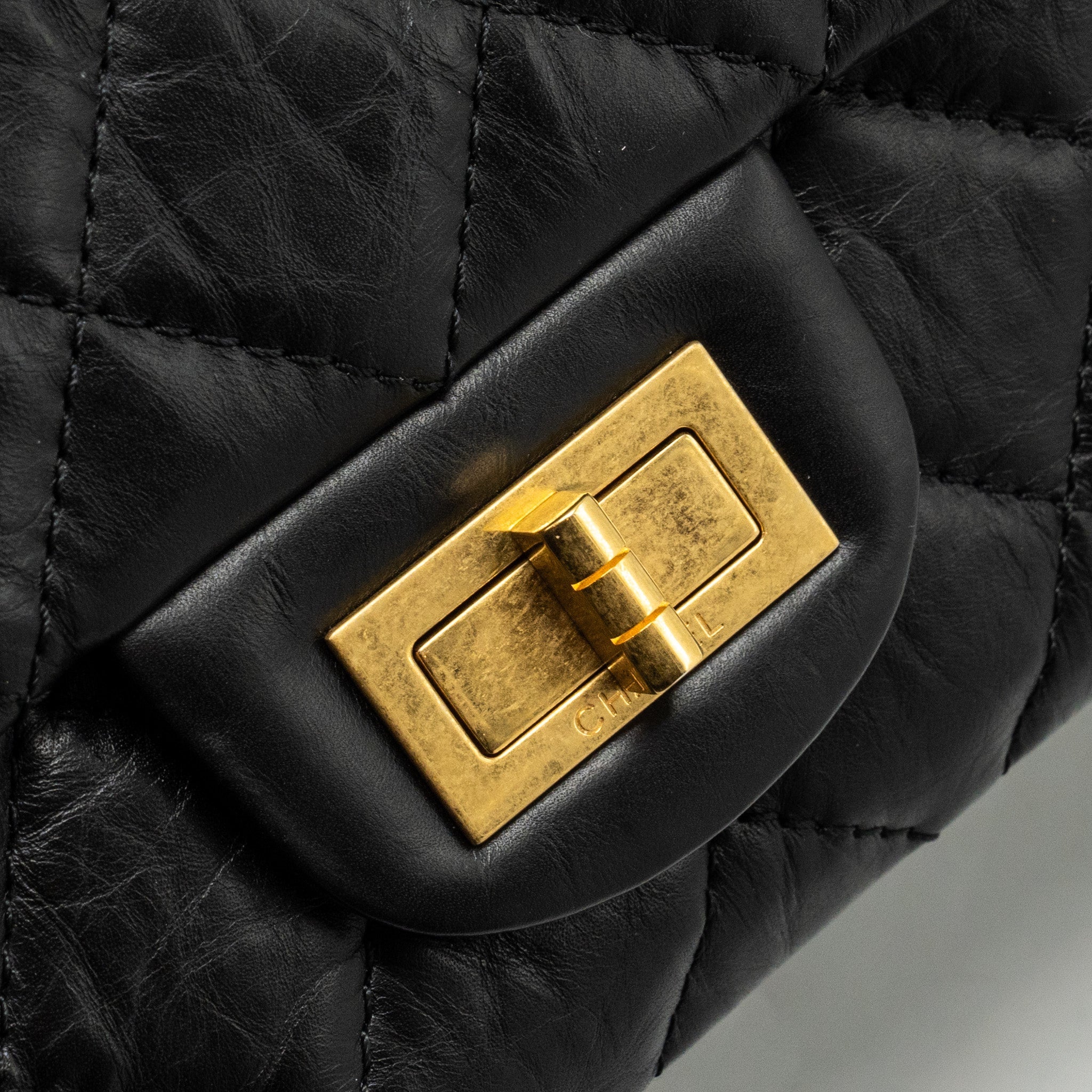 CHANEL MAXI 2.55 REISSUE FLAP BAG AGED CALFSKIN BLACK GHW