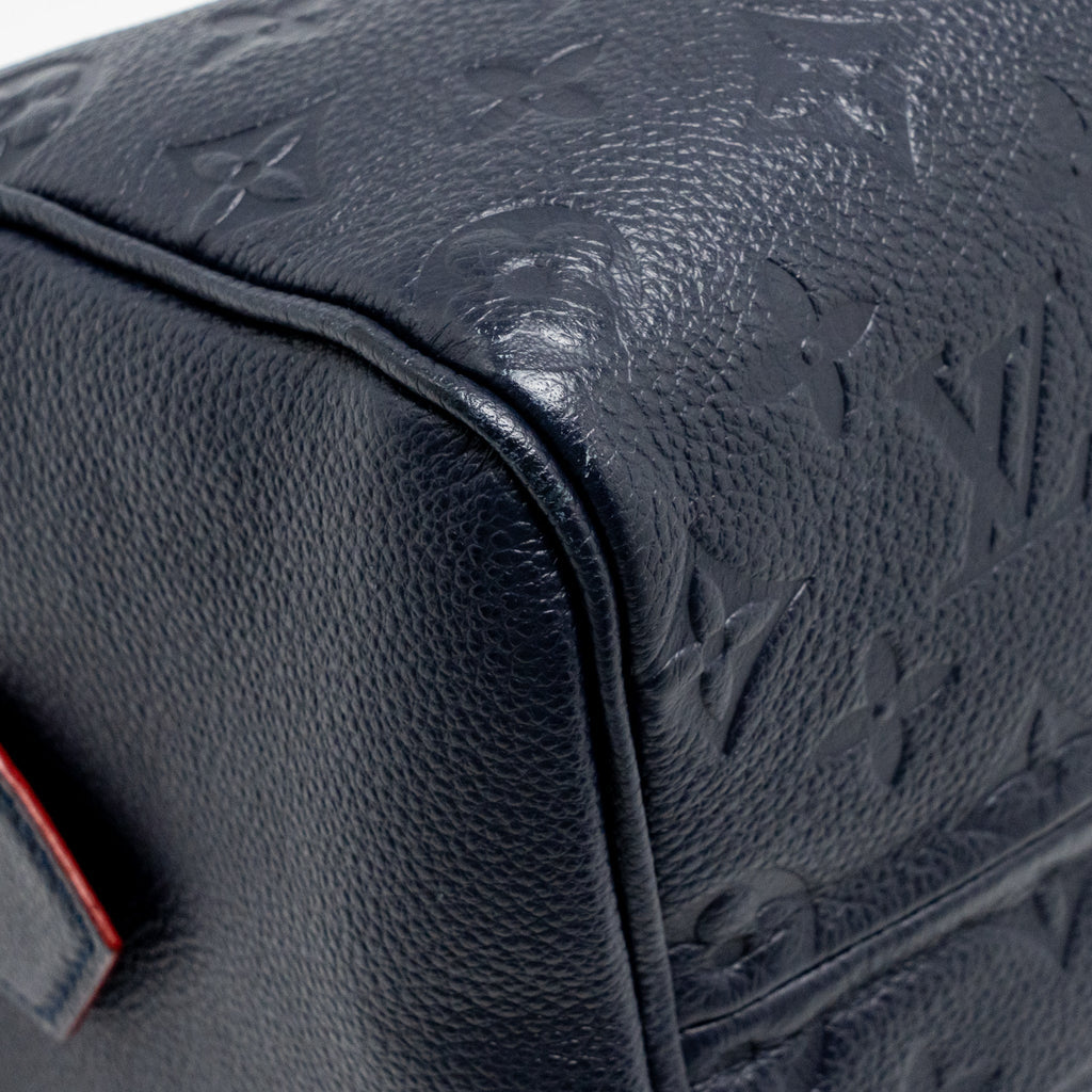LOUIS VUITTON SPEEDY 25 BANDOULIERE MONOGRAM EMPREINTE NAVY / RED GHW