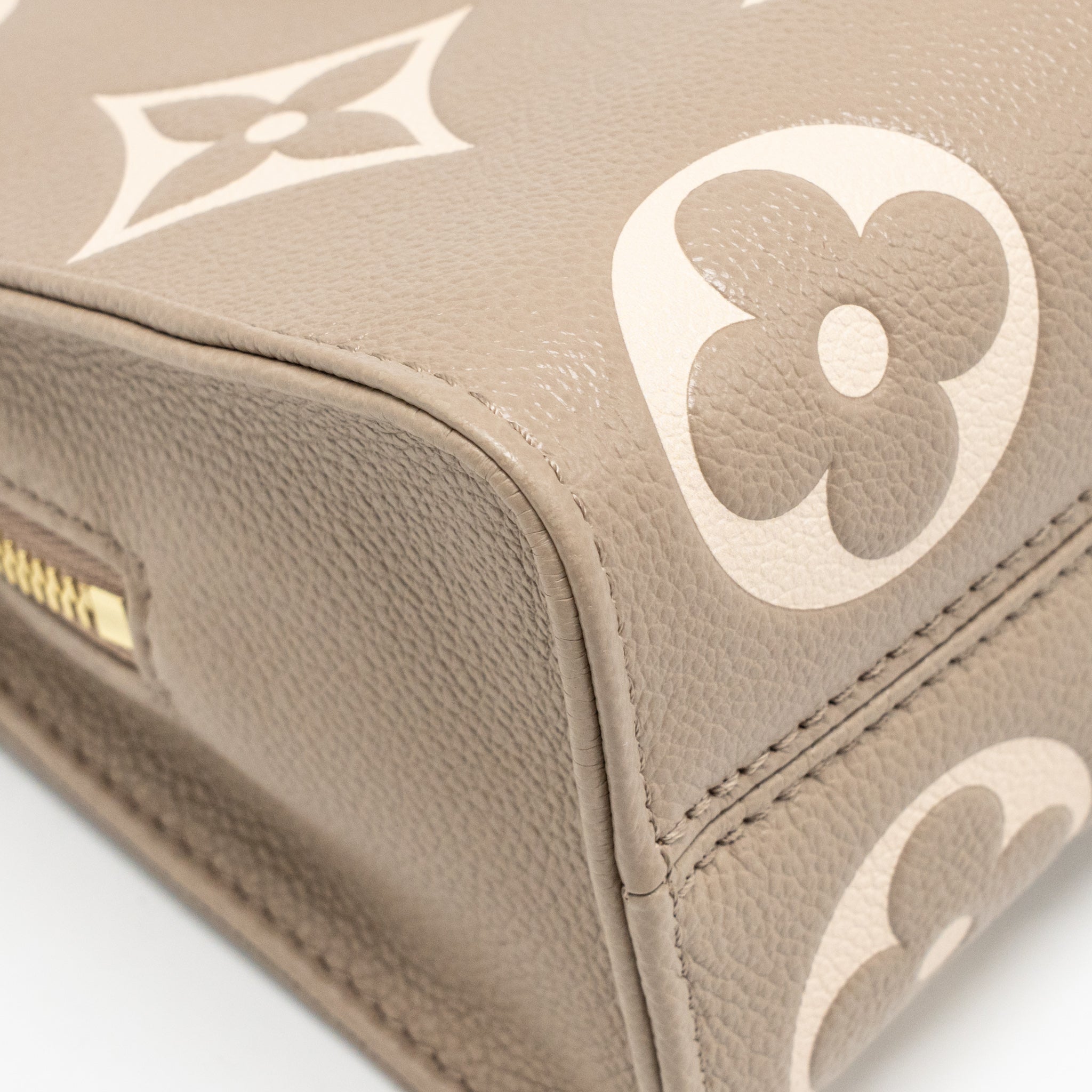 LOUIS VUITTON ONTHEGO EAST WEST MONOGRAM EMPREINTE LEATHER DOVE/CREAM GHW