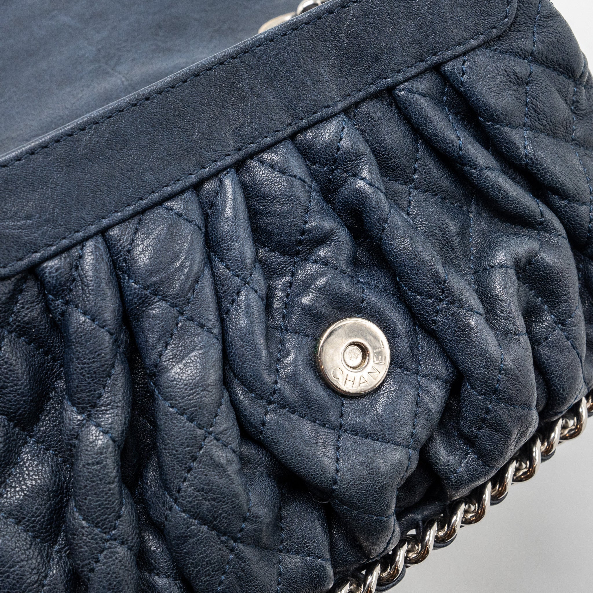 CHANEL MINI ROUND FLAP BAG WITH CHAIN AGED CALFSKIN NAVY SHW
