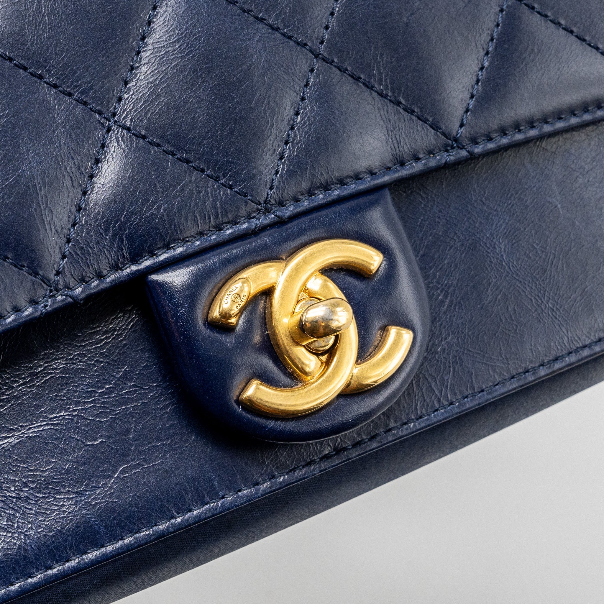 CHANEL QUILTED FLAP BAG WITH CHAIN HANDLE CALFSKIN DARK BLUE GHW