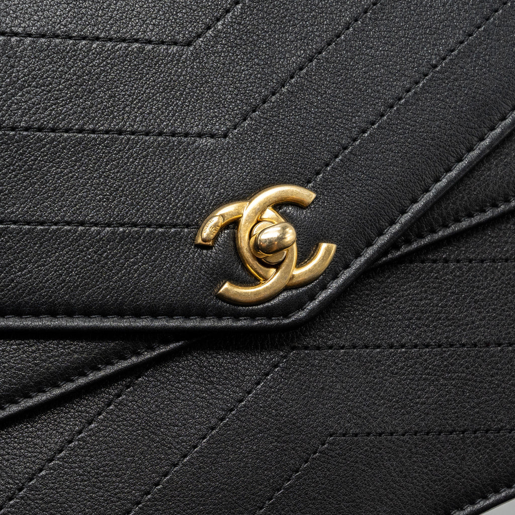 CHANEL VOYAGE CHEVRON CLUTCH CALFSKIN BLACK GHW