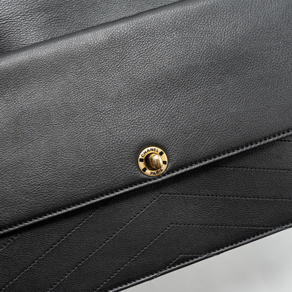 CHANEL VOYAGE CHEVRON CLUTCH CALFSKIN BLACK GHW