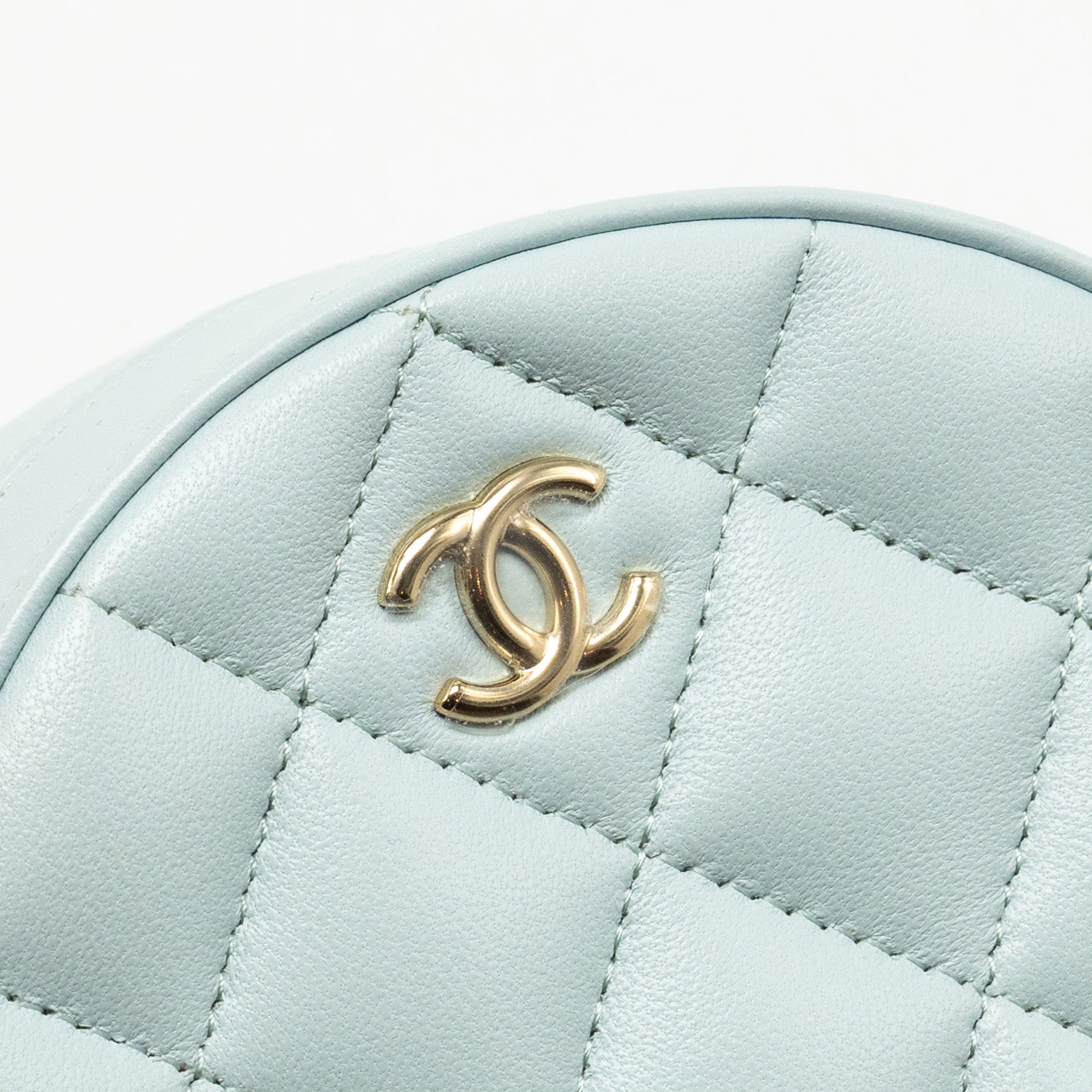 CHANEL MINI ROUND VANITY WITH RIBBON ON CHAIN LAMBSKIN LIGHT BLUE LGHW