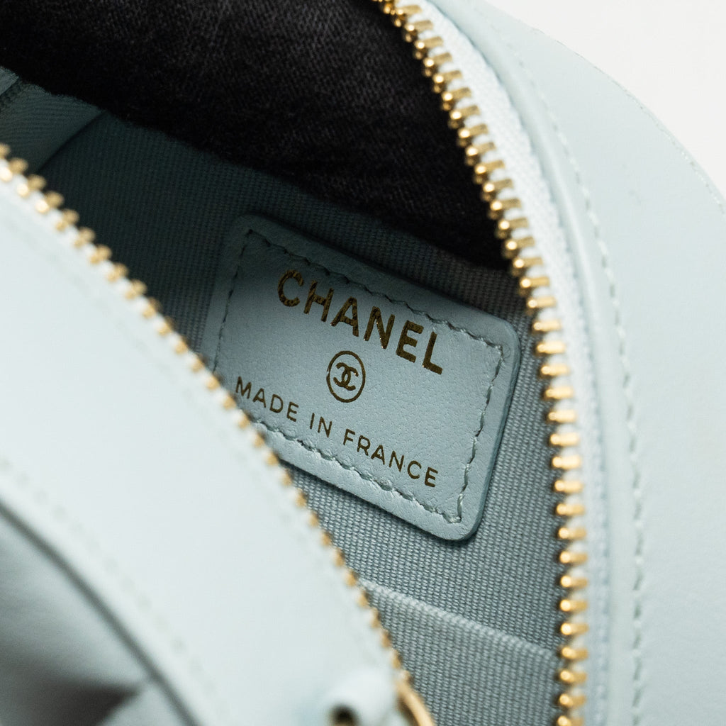 CHANEL MINI ROUND VANITY WITH RIBBON ON CHAIN LAMBSKIN LIGHT BLUE LGHW