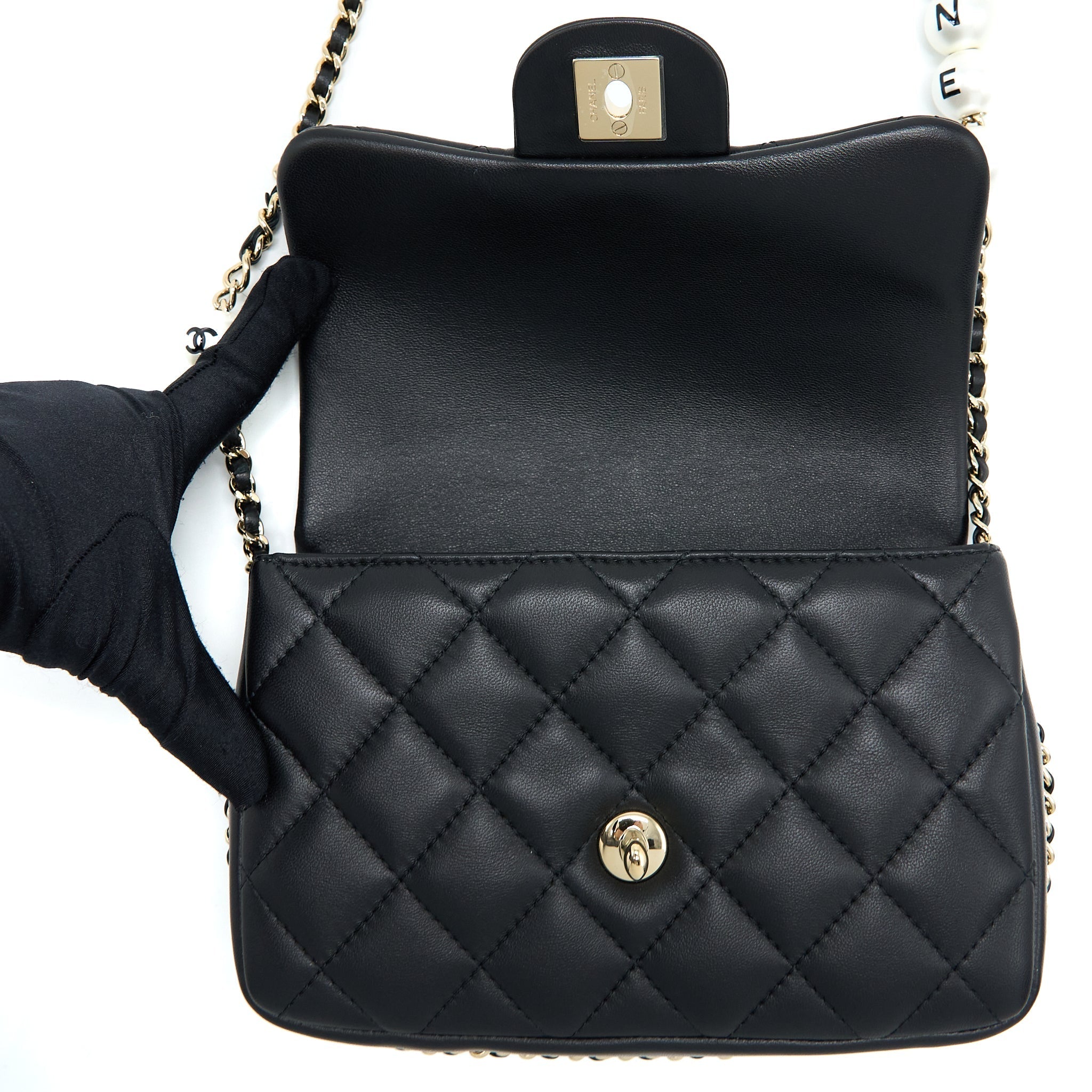 CHANEL SMALL PEARL LOGO STRAP FLAP BAG LAMBSKIN BLACK LGHW