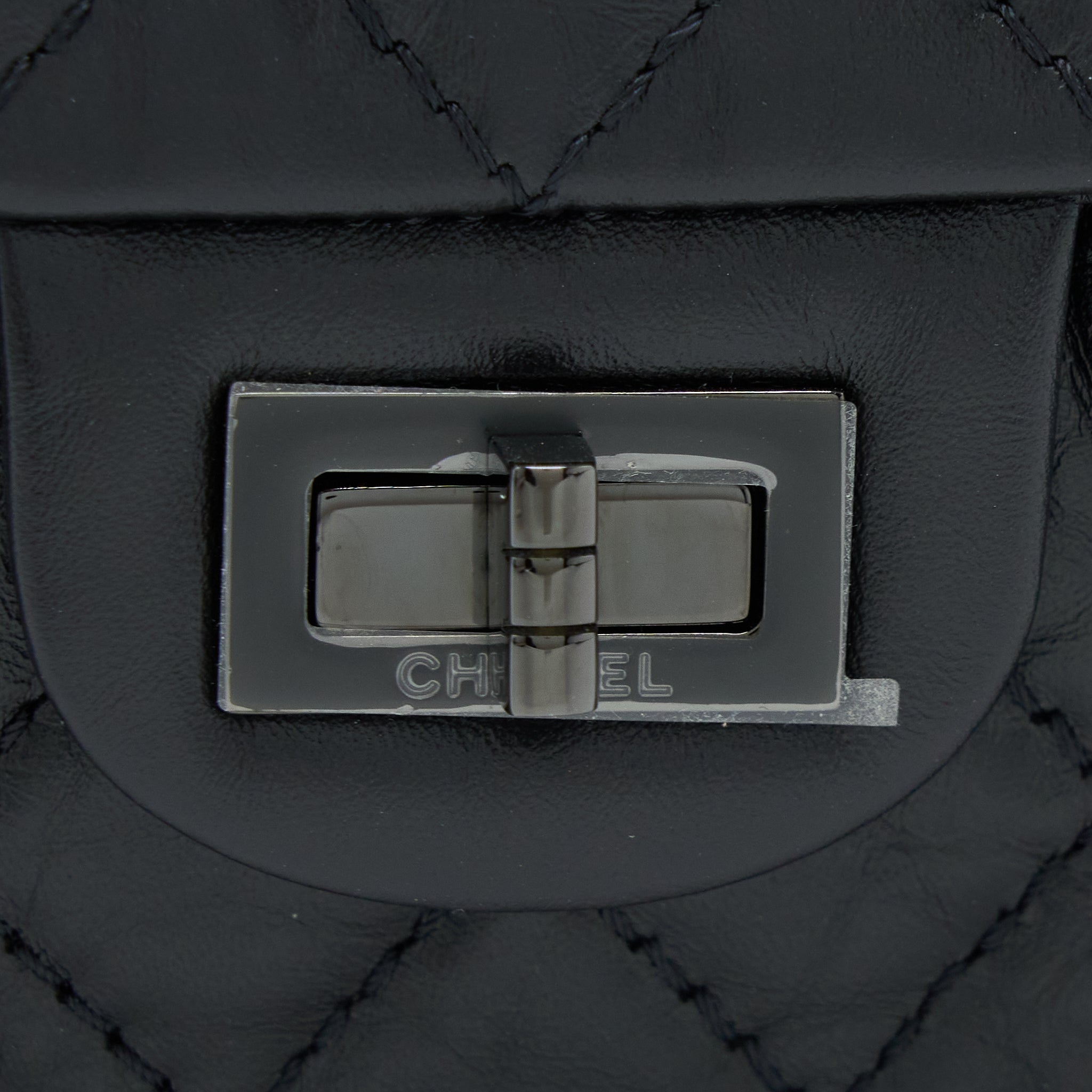 CHANEL MINI 2.55 REISSUE AGED CALFSKIN SO BLACK WITH BLACK HARDWARE (MICROCHIP)