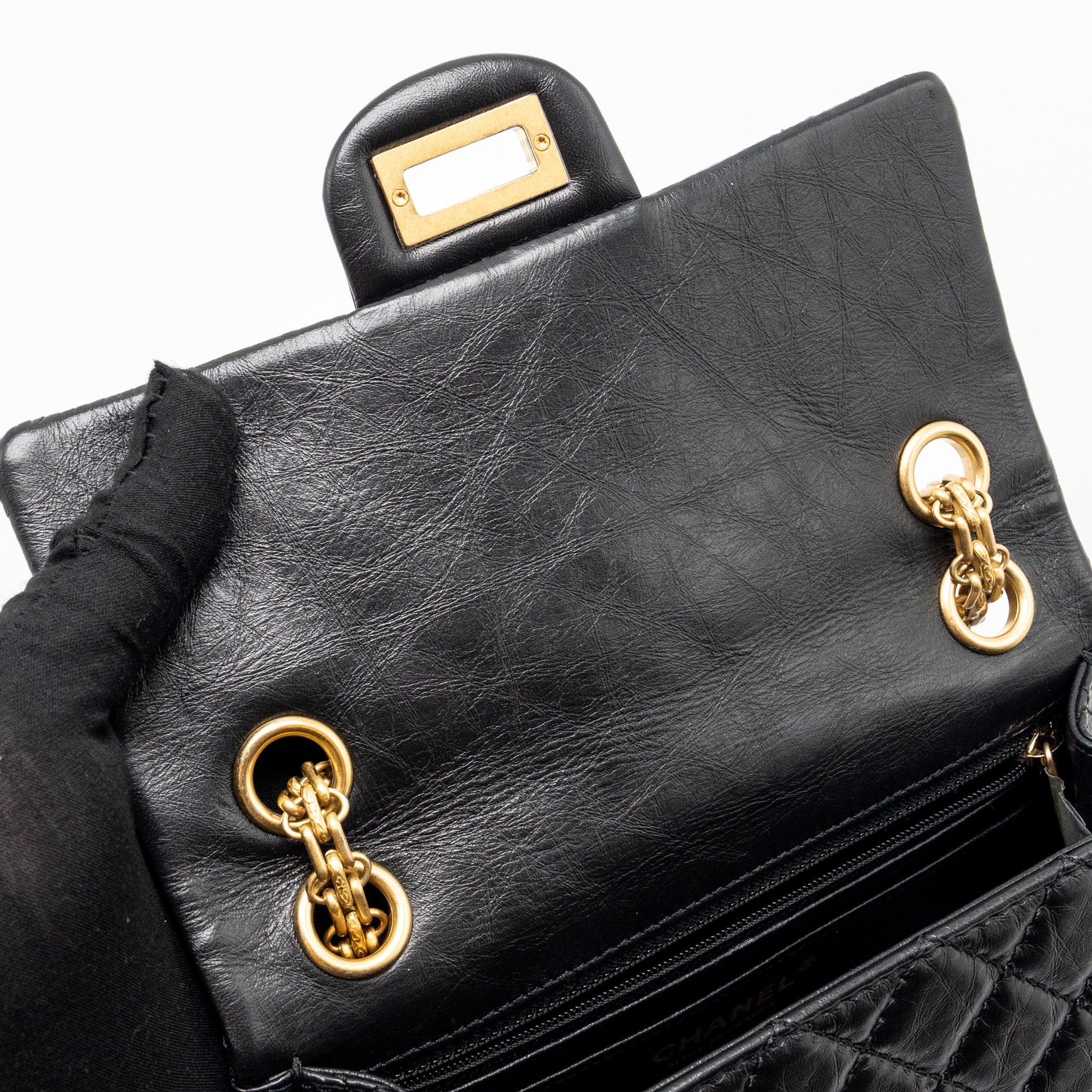 CHANEL MINI 2.55 REISSUE FLAP BAG AGED CALFSKIN BLACK GHW