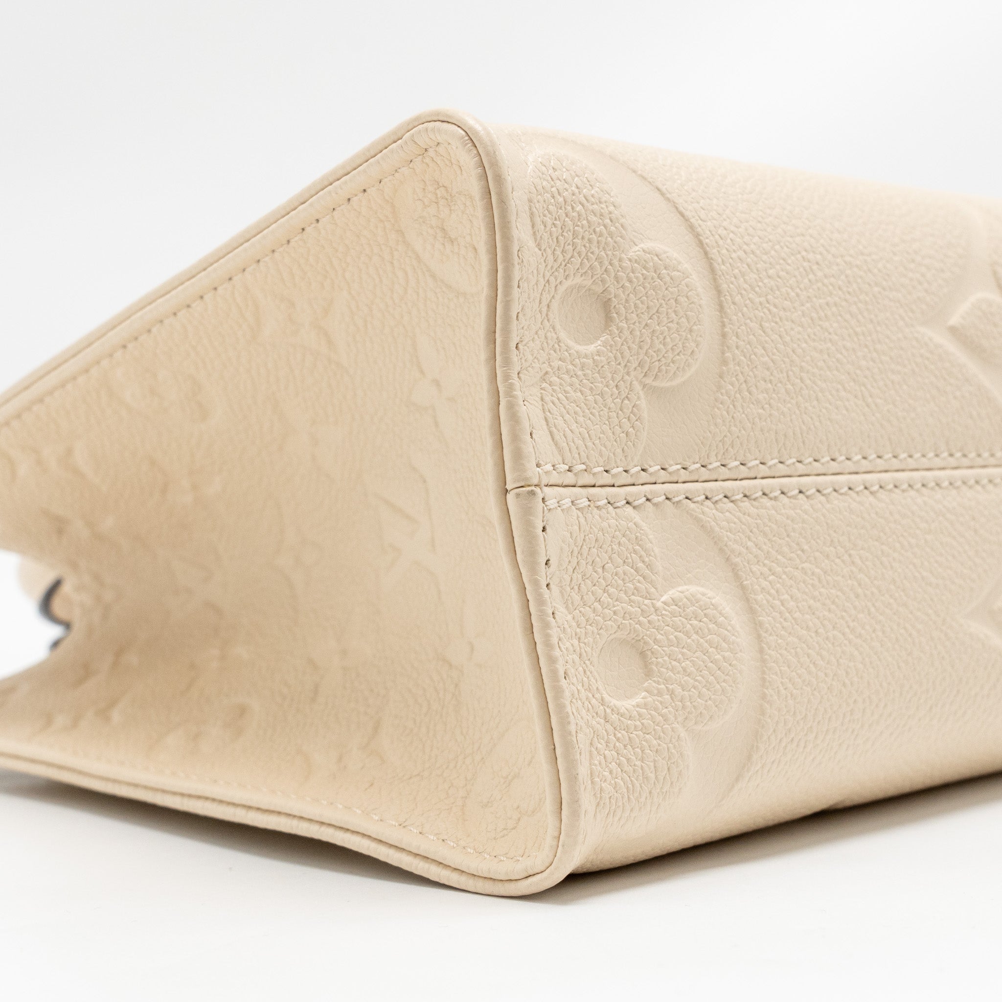 LOUIS VUITTON ONTHEGO PM MONOGRAM EMPREINTE LEATHER CREME GHW