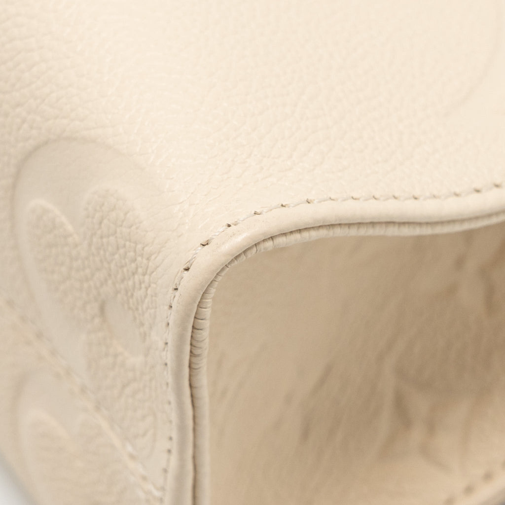 LOUIS VUITTON ONTHEGO PM MONOGRAM EMPREINTE LEATHER CREME GHW