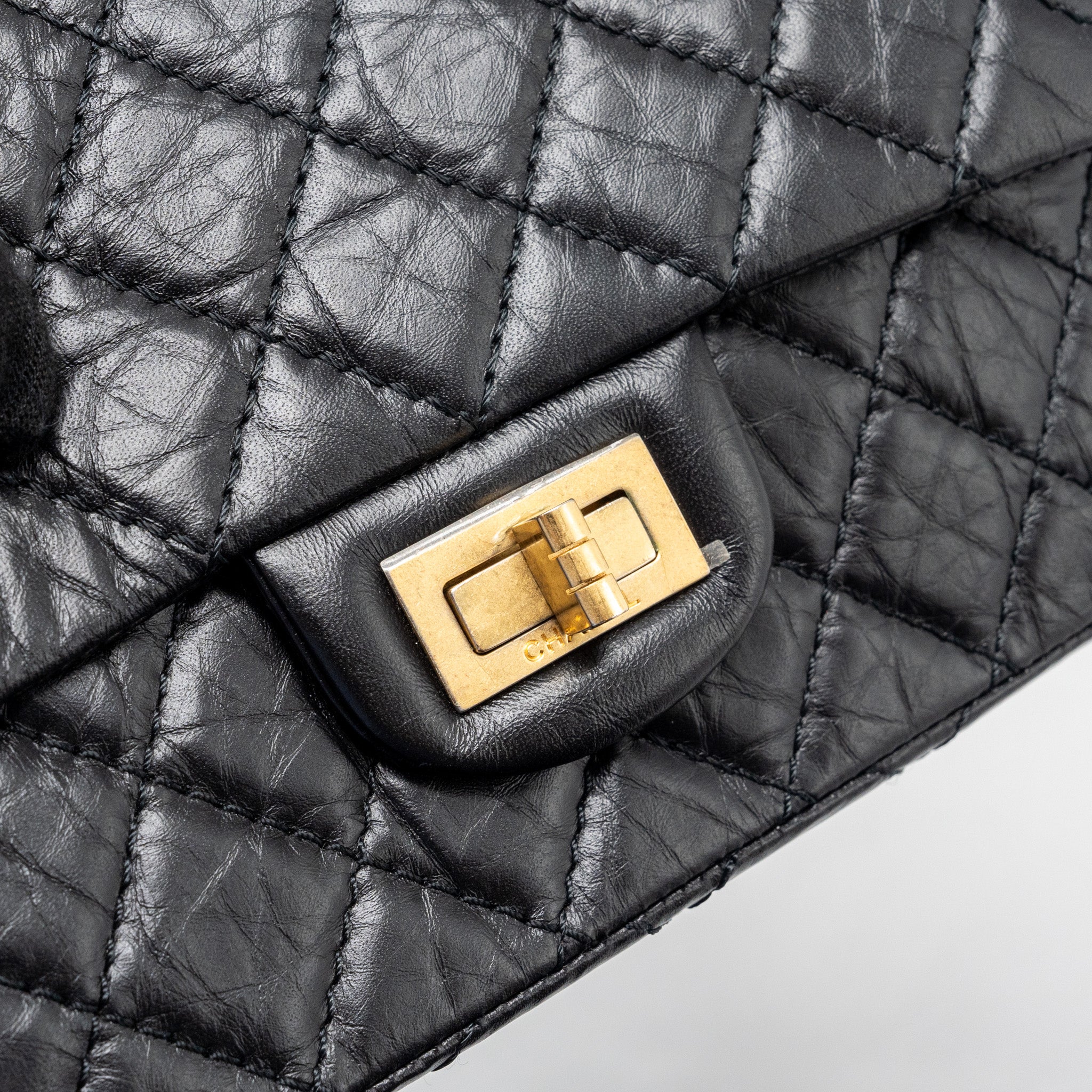 CHANEL MINI 2.55 REISSUE FLAP BAG AGED CALFSKIN BLACK GHW