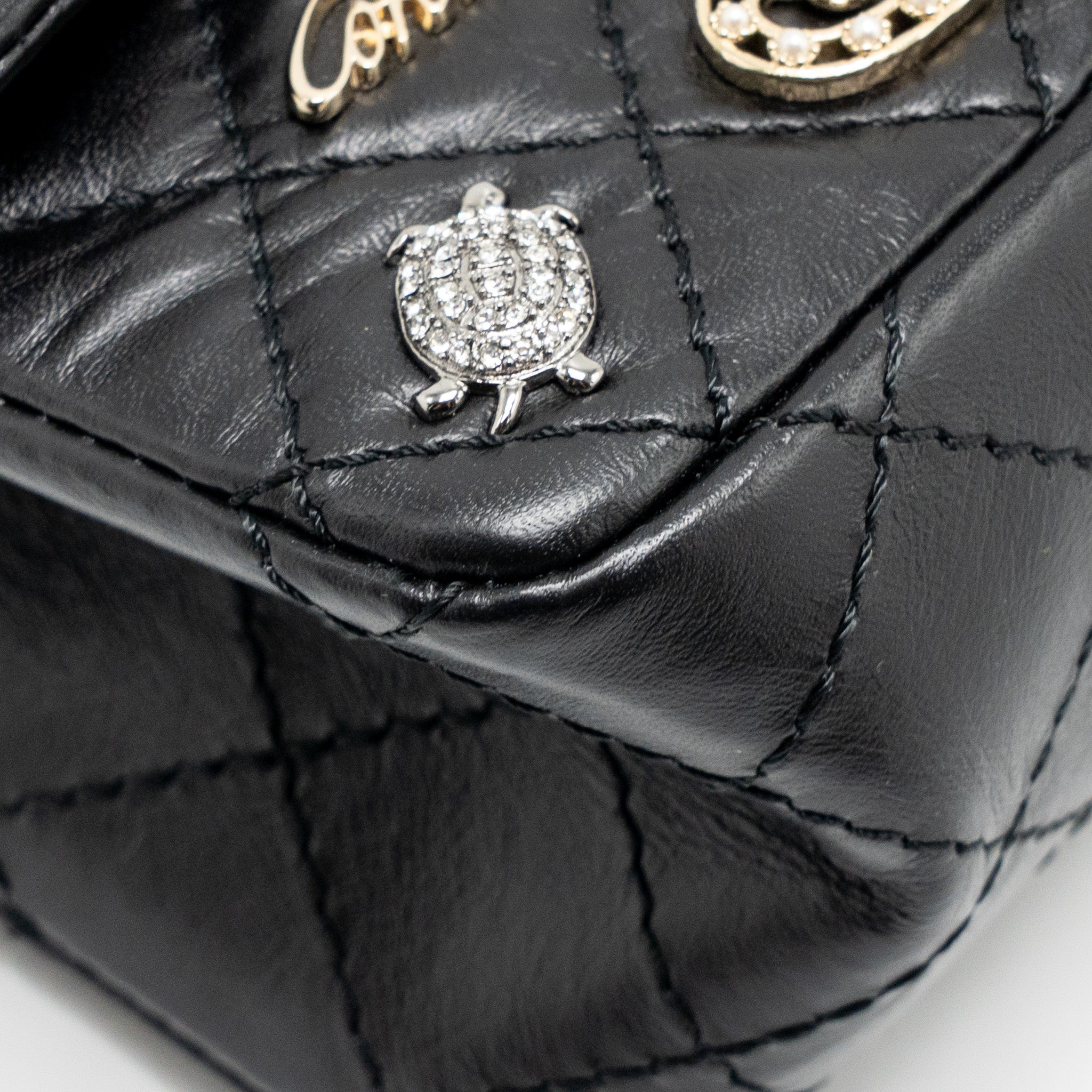 CHANEL MINI 2.55 REISSUE FLAP BAG LUCKY CHARMS AGED CALFSKIN BLACK GHW