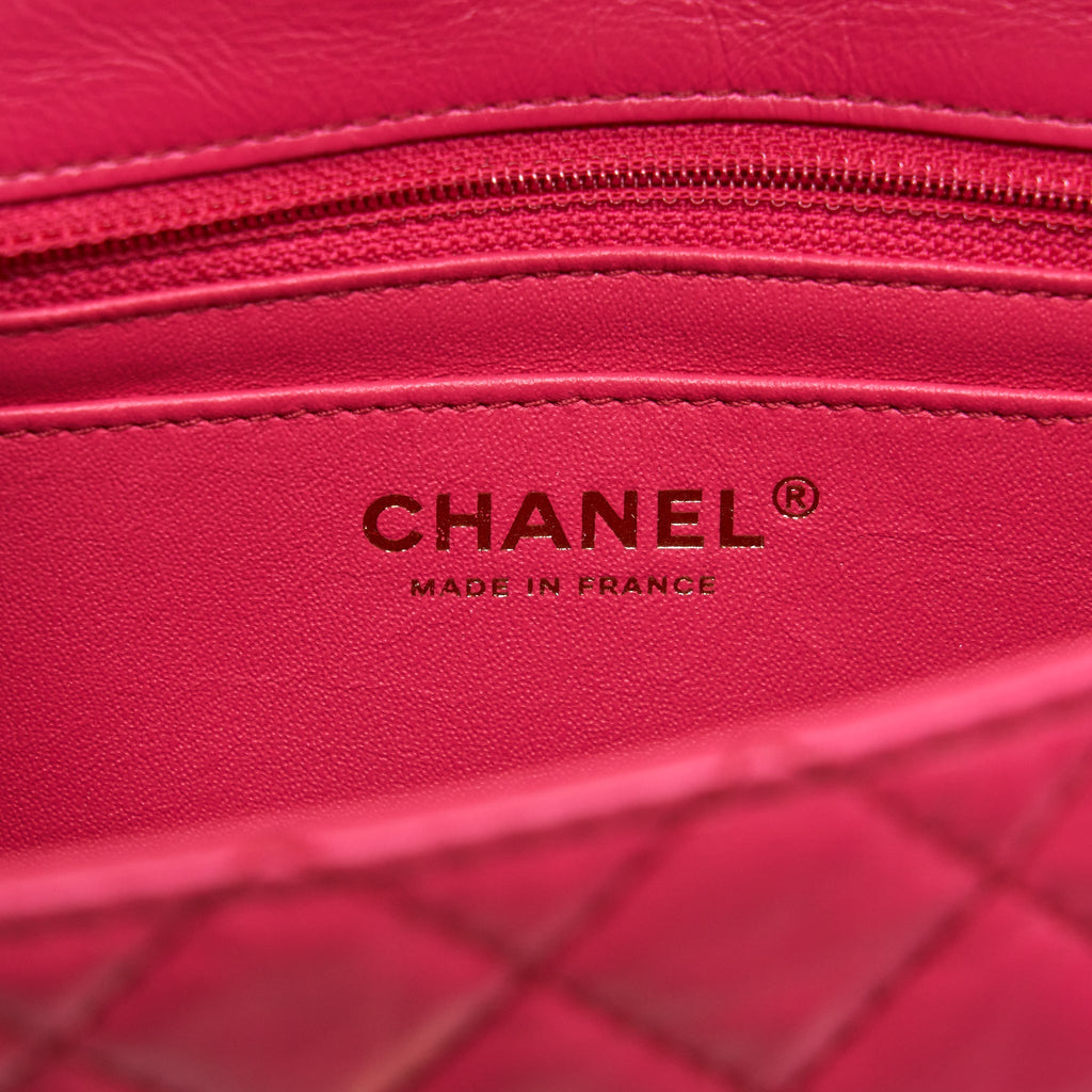 CHANEL MINI 2.55 REISSUE FLAP BAG AGED CALFSKIN HOT PINK GHW