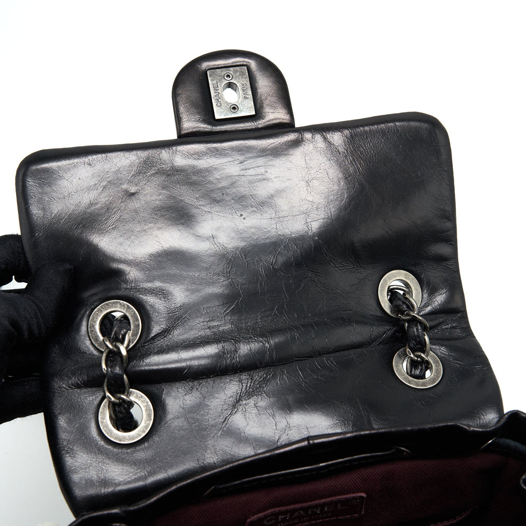 CHANEL MOUNTAIN SMALL BACKPACK SHEARLING WITH QUILTED CALFSKIN RUTHENIUM HARDWARE