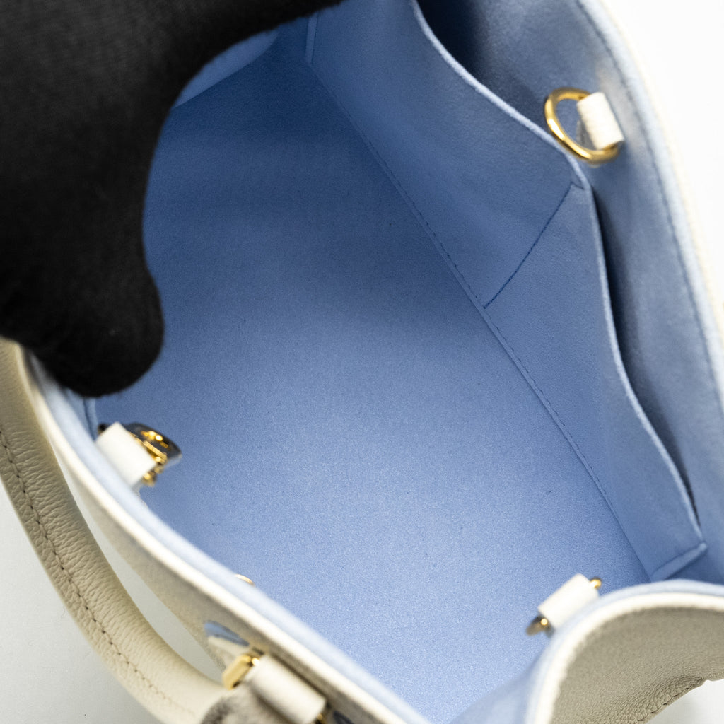 LOUIS VUITTON ONTHEGO PM BICOLOUR MONOGRAM EMPREINTE LATTE/CANDY BLUE GHW